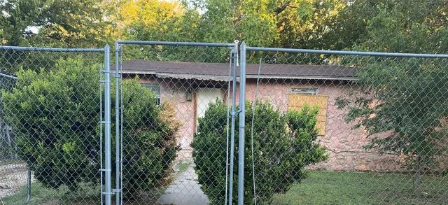 a view of a wooden deck and a garden
