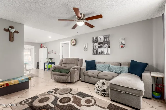 a living room with furniture and a window