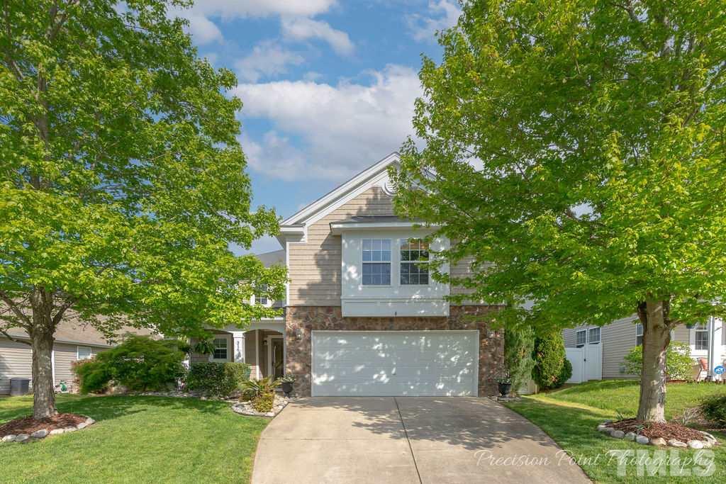 front view of a house with a yard
