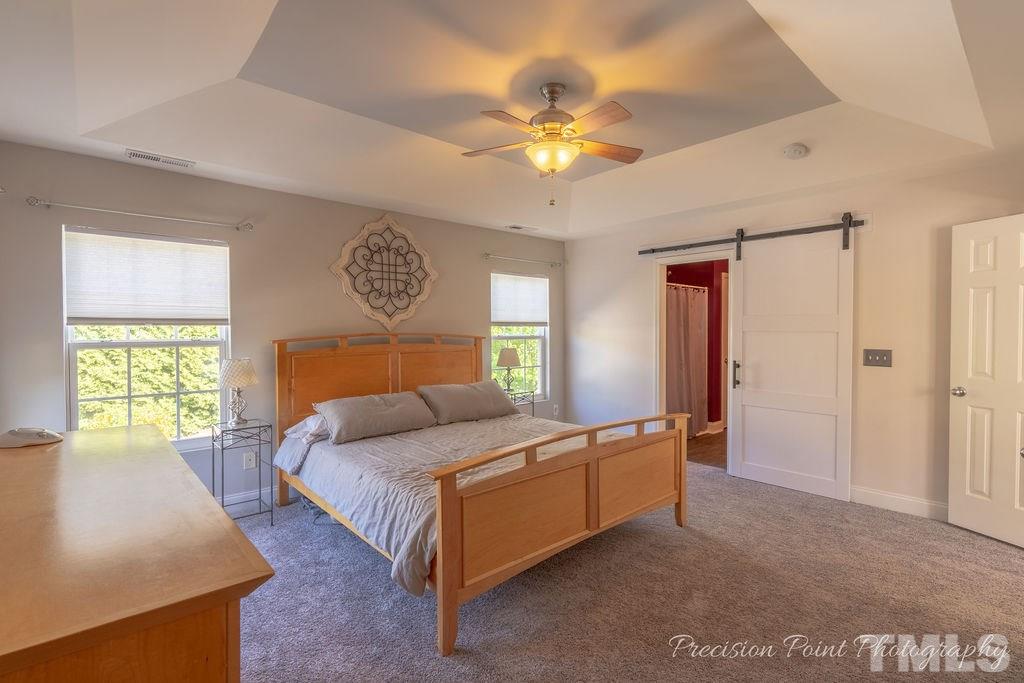 316 Steel Hopper Way Garner, NC 27529 - Photo 11 of 19 a bedroom with a bed and window