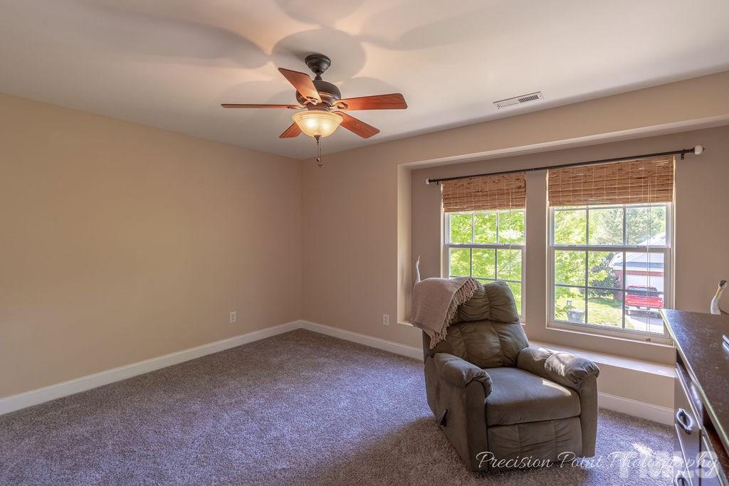 316 Steel Hopper Way Garner, NC 27529 - Photo 14 of 19 a living room with furniture and a window