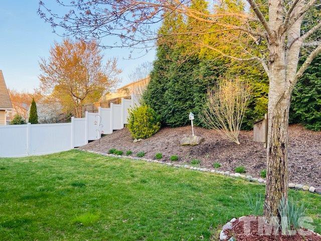 316 Steel Hopper Way Garner, NC 27529 - Photo 16 of 19 a view of a backyard with large trees