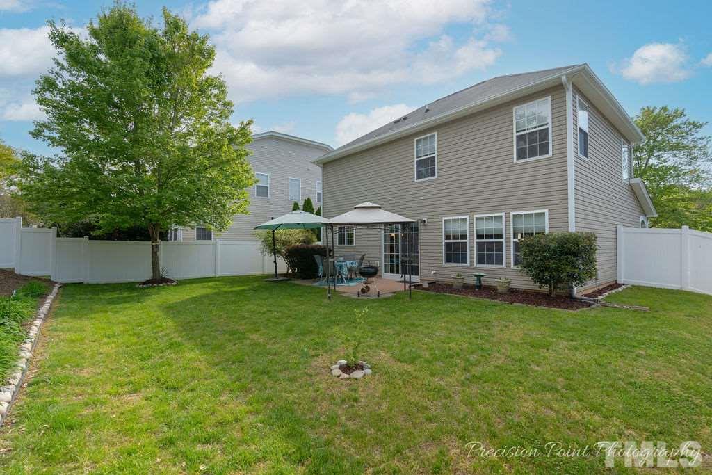 316 Steel Hopper Way Garner, NC 27529 - Photo 17 of 19 a view of a house with backyard and sitting area