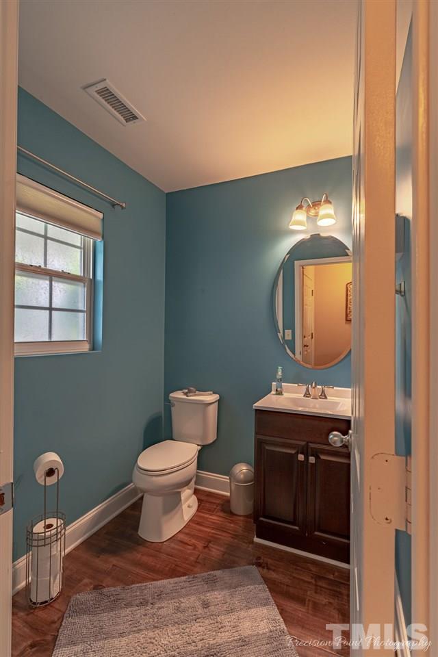 316 Steel Hopper Way Garner, NC 27529 - Photo 8 of 19 a bathroom with a toilet sink and mirror