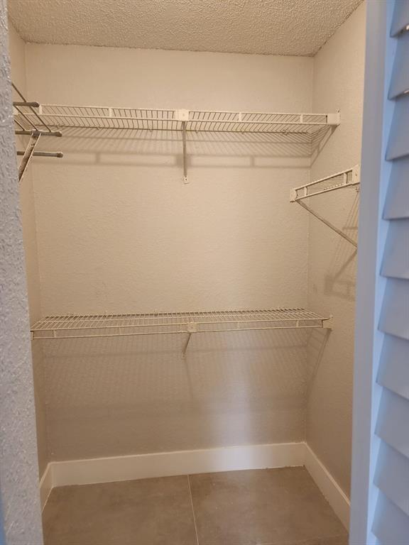 1229 Southwest 46th Avenue, Unit 405 Pompano Beach, FL 33069 - Photo 11 of 26 a view of a room with racks on the wall