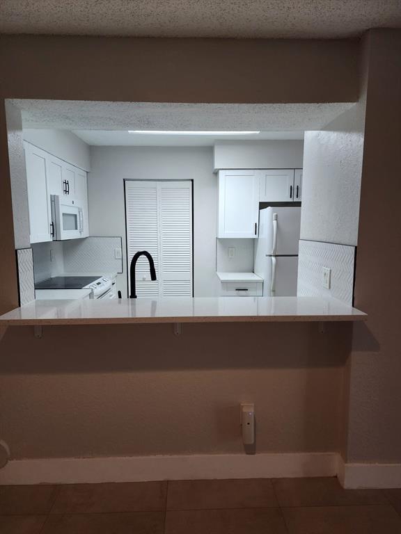 1229 Southwest 46th Avenue, Unit 405 Pompano Beach, FL 33069 - Photo 21 of 26 a close view of sink and tap