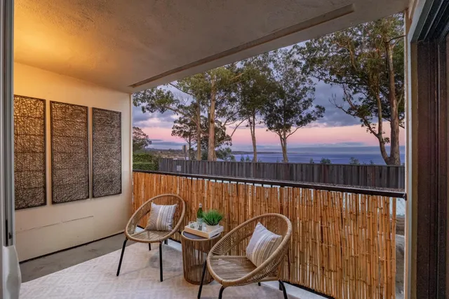 a view of a chairs and table in patio