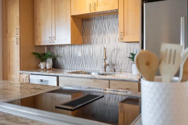 a kitchen with a sink and cabinets