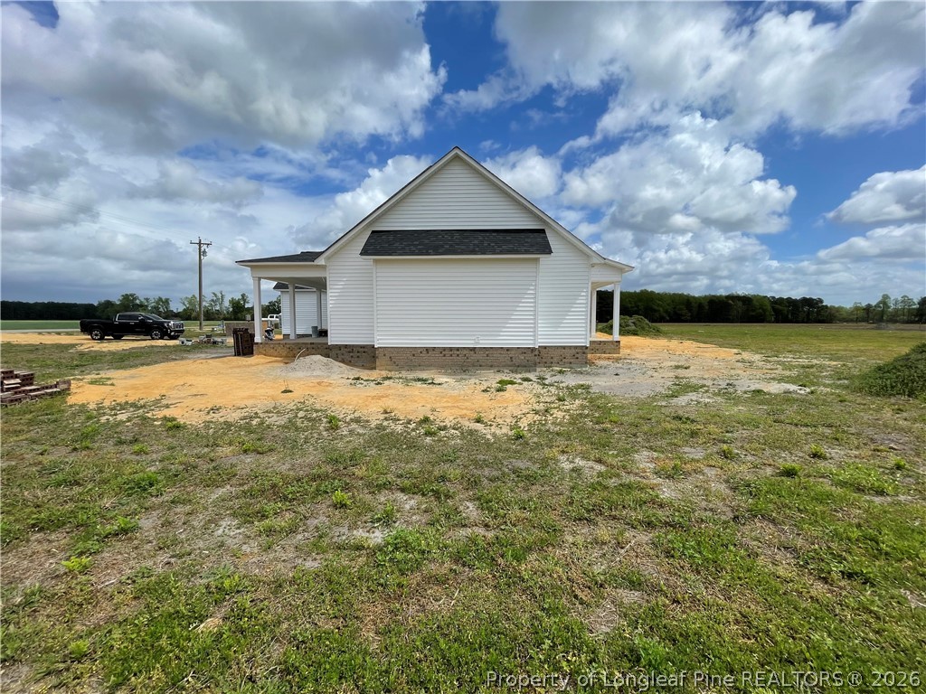 1097 Purdie-Hall Road Tar Heel, NC 28392 - Photo 3 of 5 a view of a house with a yard