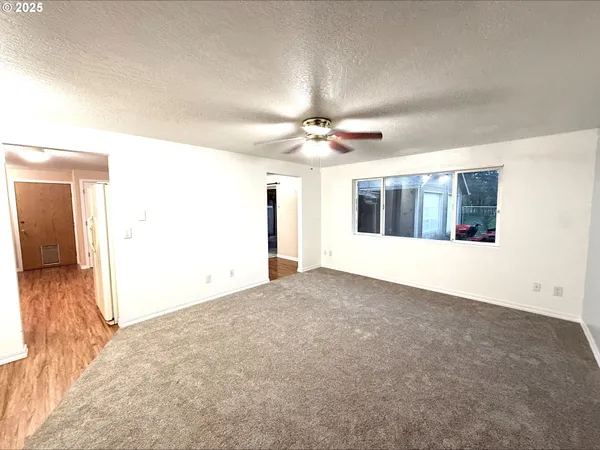 a view of a livingroom with a ceiling fan