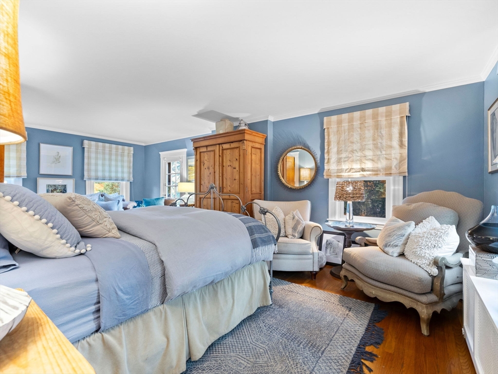 81 Arborway Boston, MA 02130 - Photo 12 of 29 a bedroom with a bed couch and window