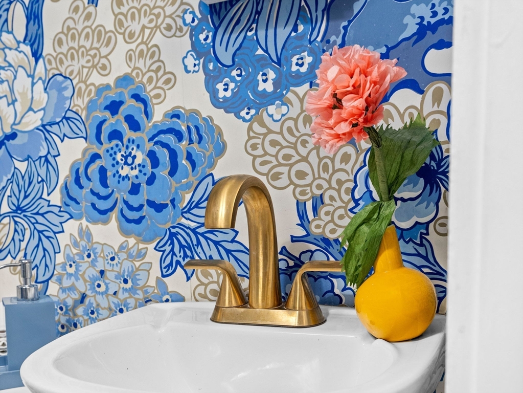 81 Arborway Boston, MA 02130 - Photo 19 of 29 a bathroom with a bathtub and mirror