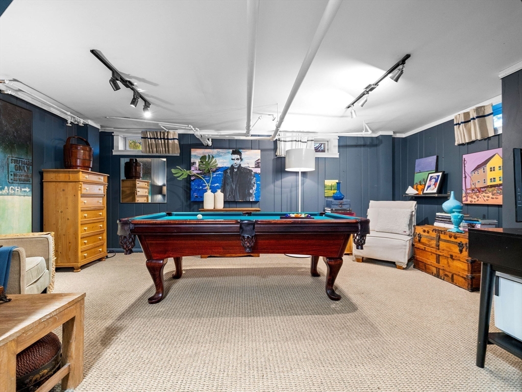 81 Arborway Boston, MA 02130 - Photo 20 of 29 a room with furniture and a flat screen tv