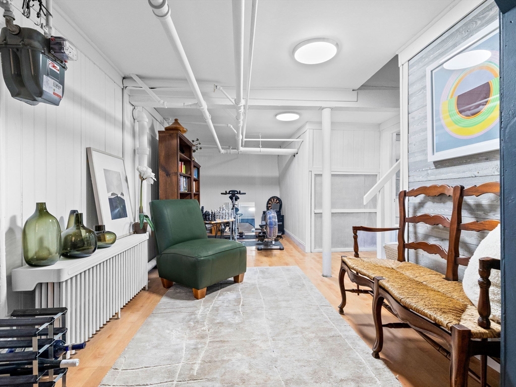 81 Arborway Boston, MA 02130 - Photo 21 of 29 a living room with furniture and a rug