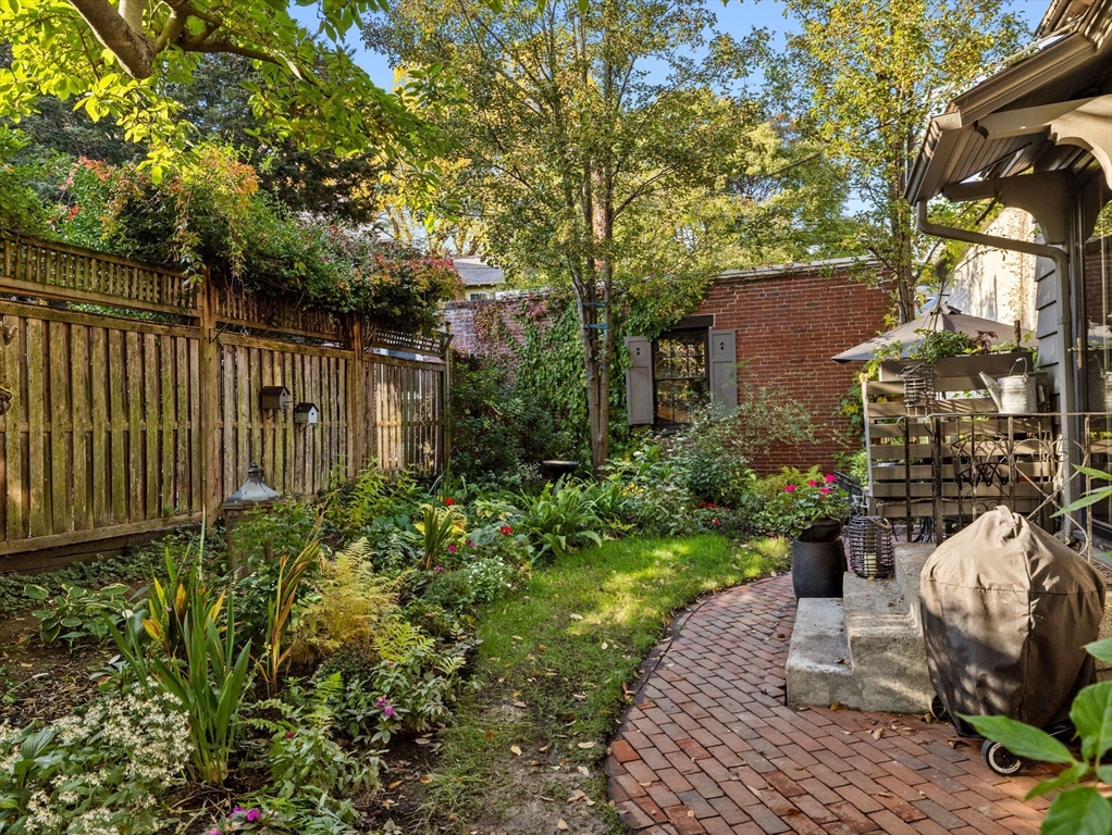 81 Arborway Boston, MA 02130 - Photo 24 of 29 a view of a chair and table in backyard