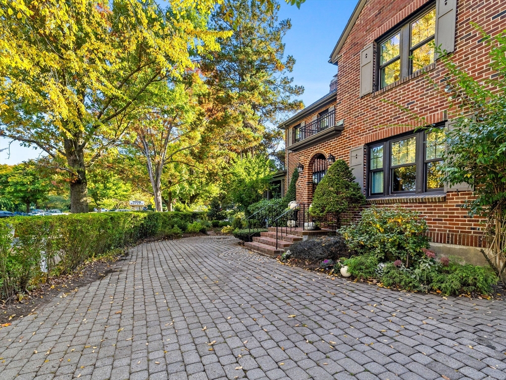 81 Arborway Boston, MA 02130 - Photo 26 of 29 a front view of a house with garden