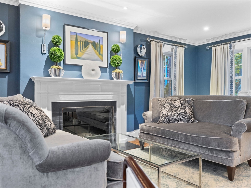 81 Arborway Boston, MA 02130 - Photo 4 of 29 a living room with furniture and a fireplace