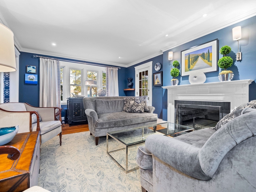81 Arborway Boston, MA 02130 - Photo 5 of 29 a living room with furniture and a fireplace