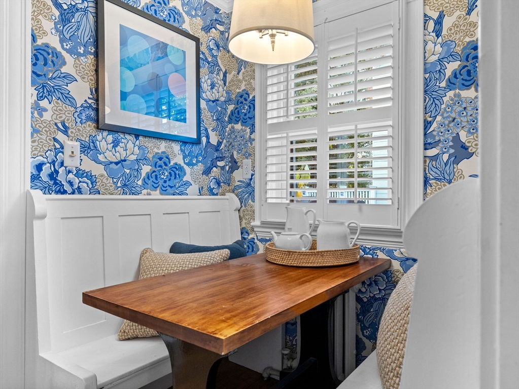 81 Arborway Boston, MA 02130 - Photo 7 of 29 a room with a table and chairs