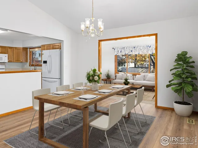 a view of a cafe with a flower garden