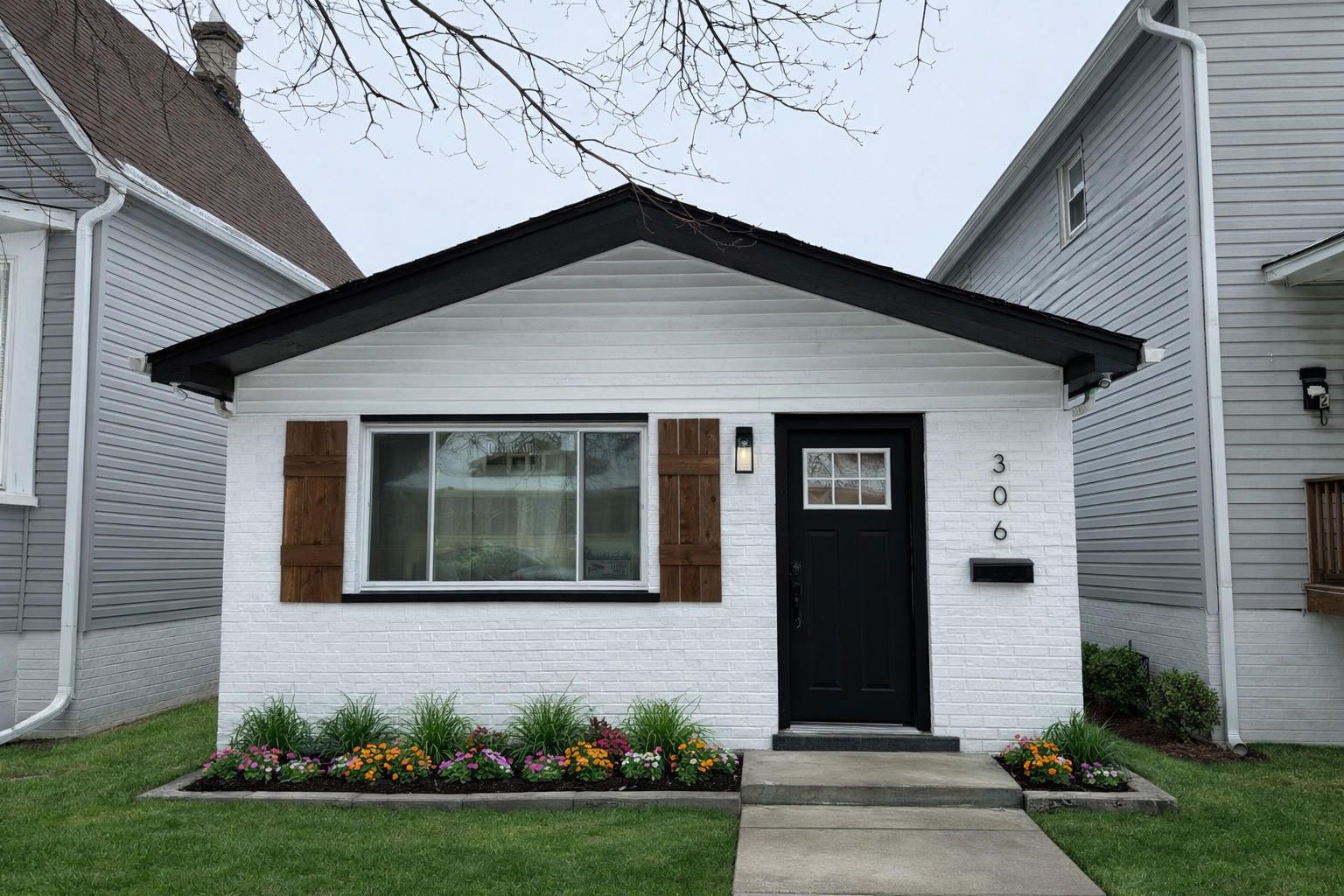 a front view of a house with garden