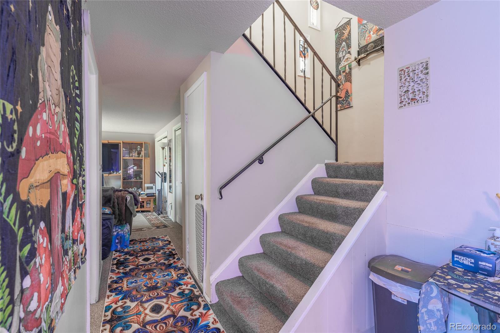 6727 Dale Road Colorado Springs, CO 80915 - Photo 17 of 18 a view of entryway with furniture and stairs