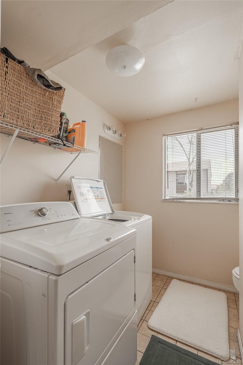 6727 Dale Road Colorado Springs, CO 80915 - Photo 18 of 18 a utility room with dryer and washer
