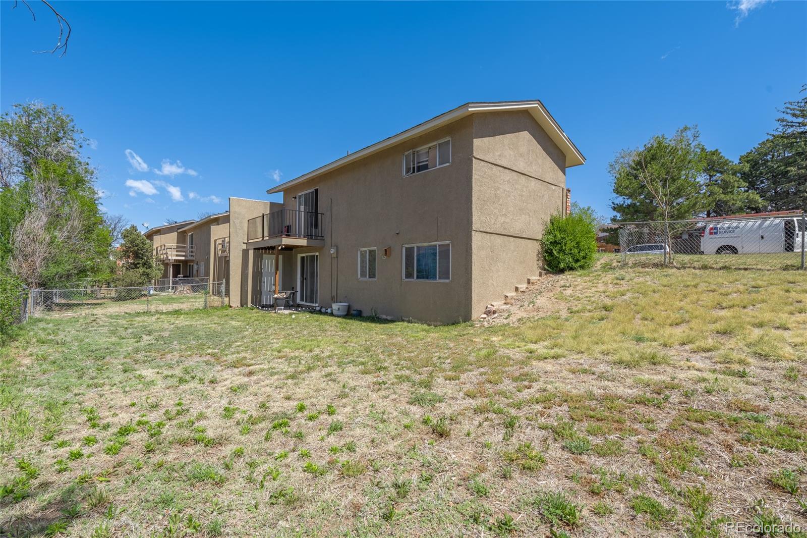 6727 Dale Road Colorado Springs, CO 80915 - Photo 4 of 18 a backyard of a house