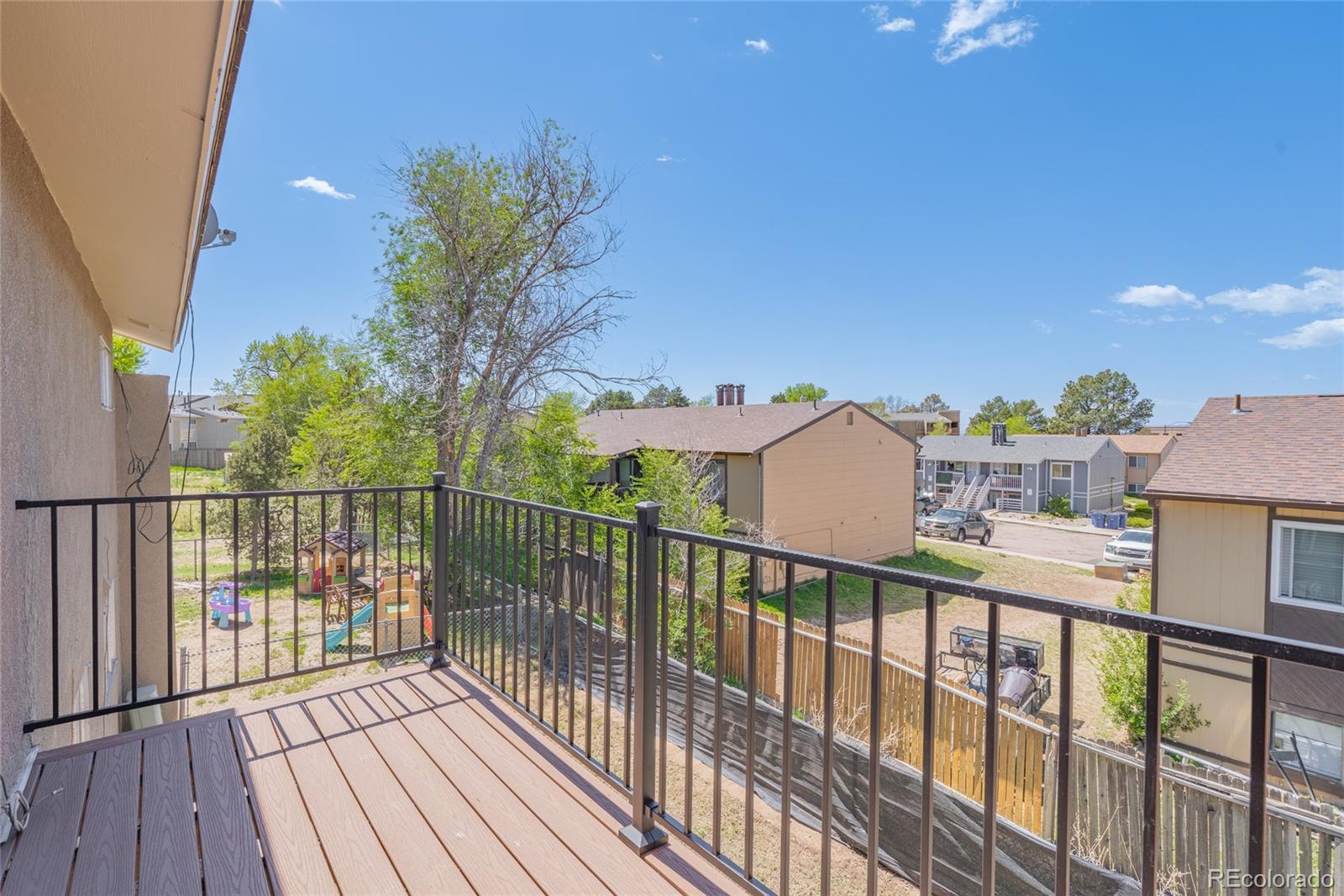 6727 Dale Road Colorado Springs, CO 80915 - Photo 5 of 18 a view of a houses with a balcony