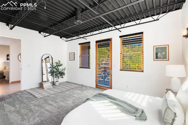 a bed room with a bed and a window