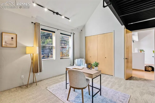 a view of a livingroom with furniture and window