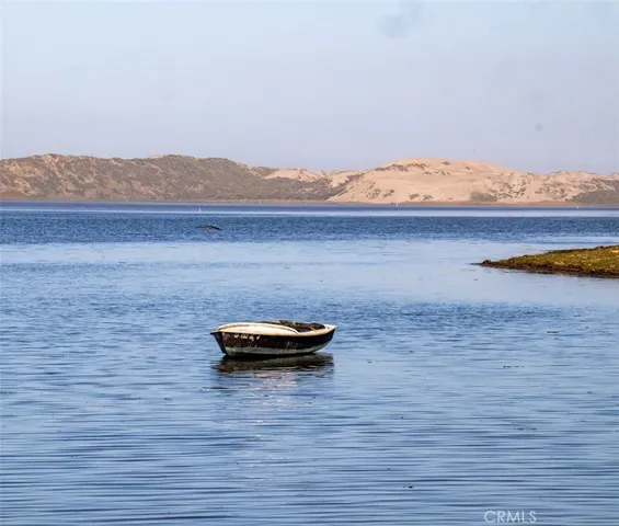 a view of a lake with furniture