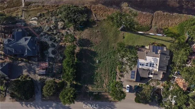 an aerial view of a house with outdoor space and street view