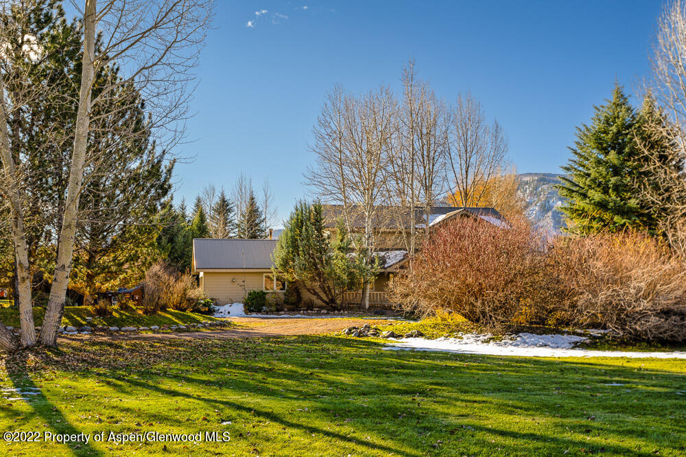 98 Lewis Lane Basalt, CO 81621 - Photo 24 of 31 a swimming pool with trees in the background