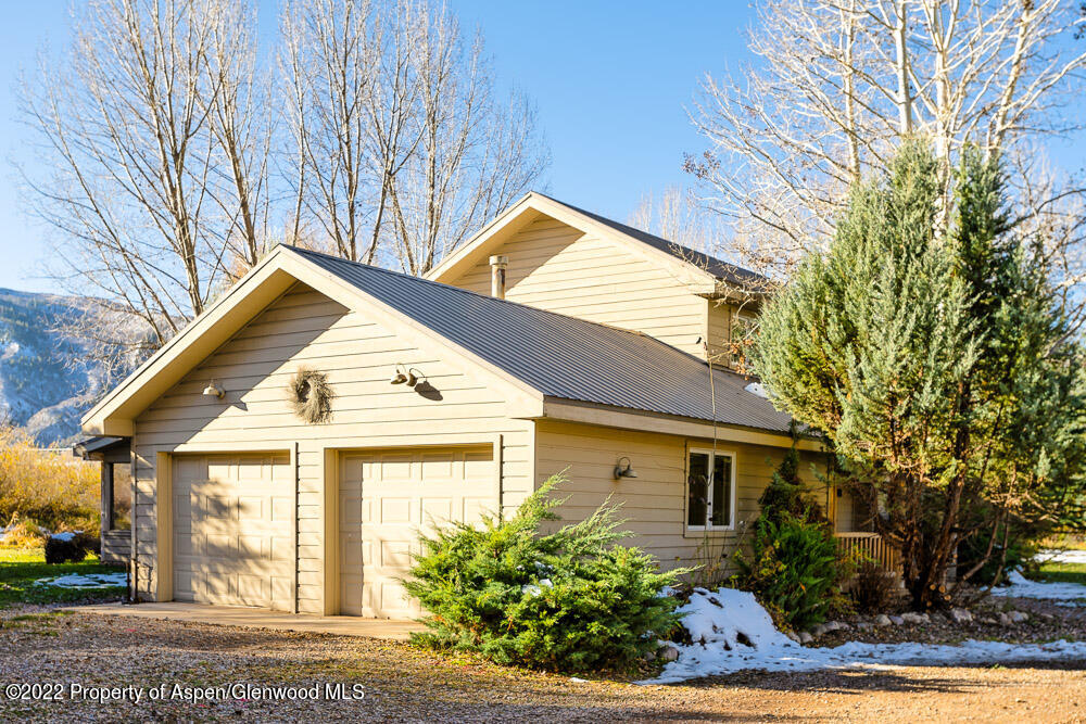 98 Lewis Lane Basalt, CO 81621 - Photo 26 of 31 a view of a house with a yard and plants