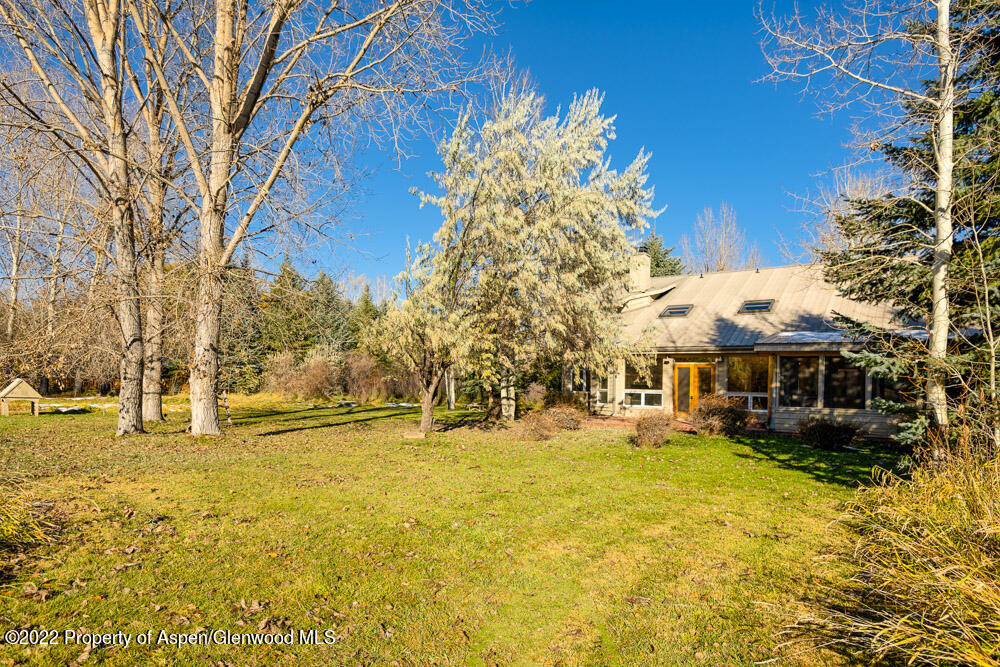 98 Lewis Lane Basalt, CO 81621 - Photo 30 of 31 a view of a swimming pool with a house in the background