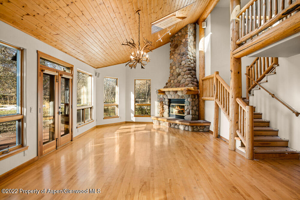 98 Lewis Lane Basalt, CO 81621 - Photo 4 of 31 a view of an entryway with wooden floor and a fireplace
