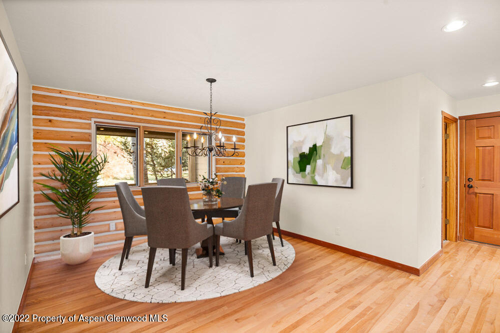 98 Lewis Lane Basalt, CO 81621 - Photo 9 of 31 a view of a dining room with furniture window and wooden floor