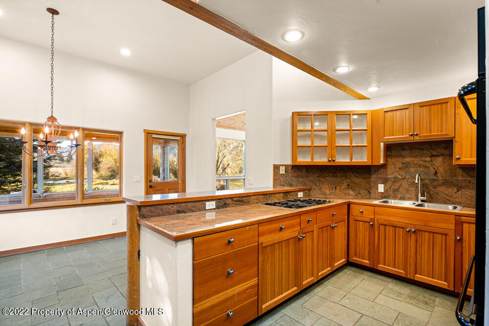 98 Lewis Lane Basalt, CO 81621 - Photo 10 of 31 a kitchen with a sink stove and cabinets