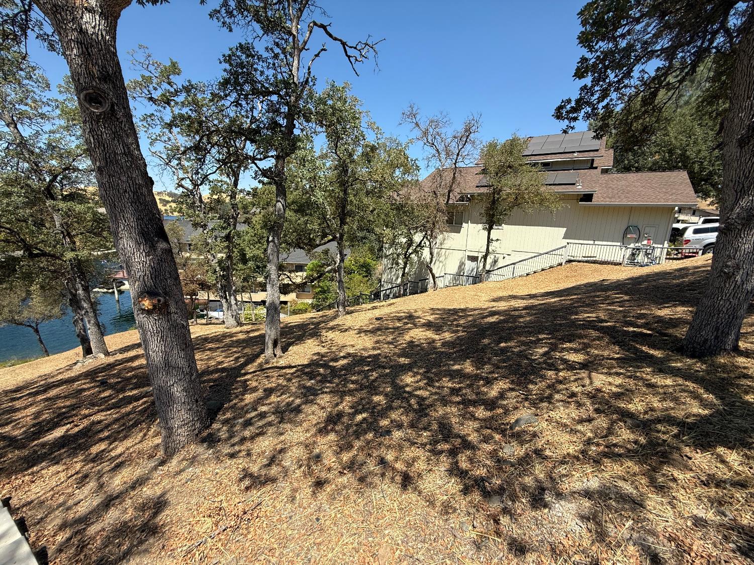 554 Sunrise Road Copperopolis, CA 95228 - Photo 16 of 20 a view of a yard with wooden fence