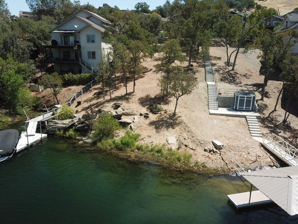 554 Sunrise Road Copperopolis, CA 95228 - Photo 10 of 20 a view of a lake with a house in the background