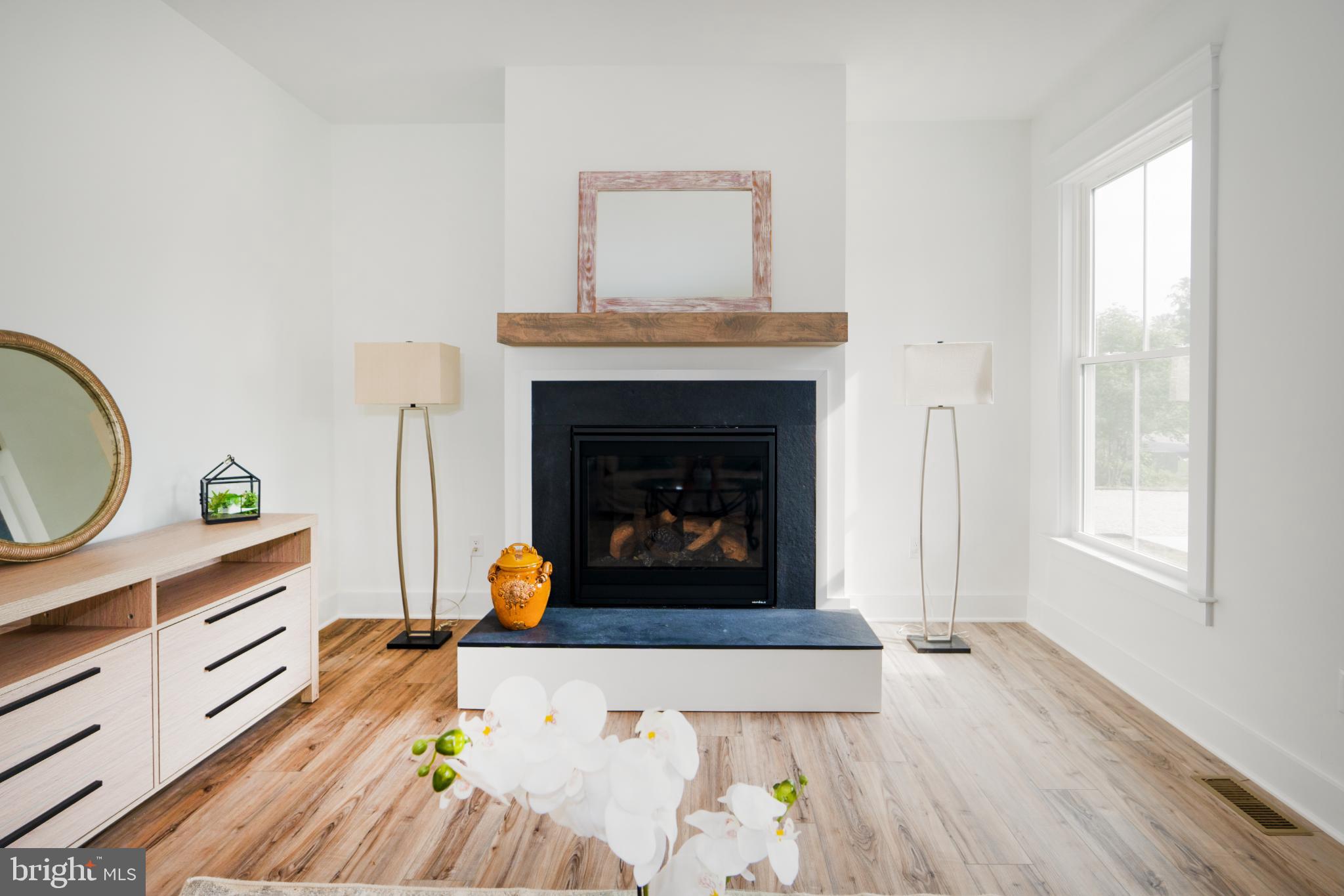 723 Rainbow Ridge Bumpass, VA 23024 - Photo 11 of 60 a living room with furniture and a fireplace