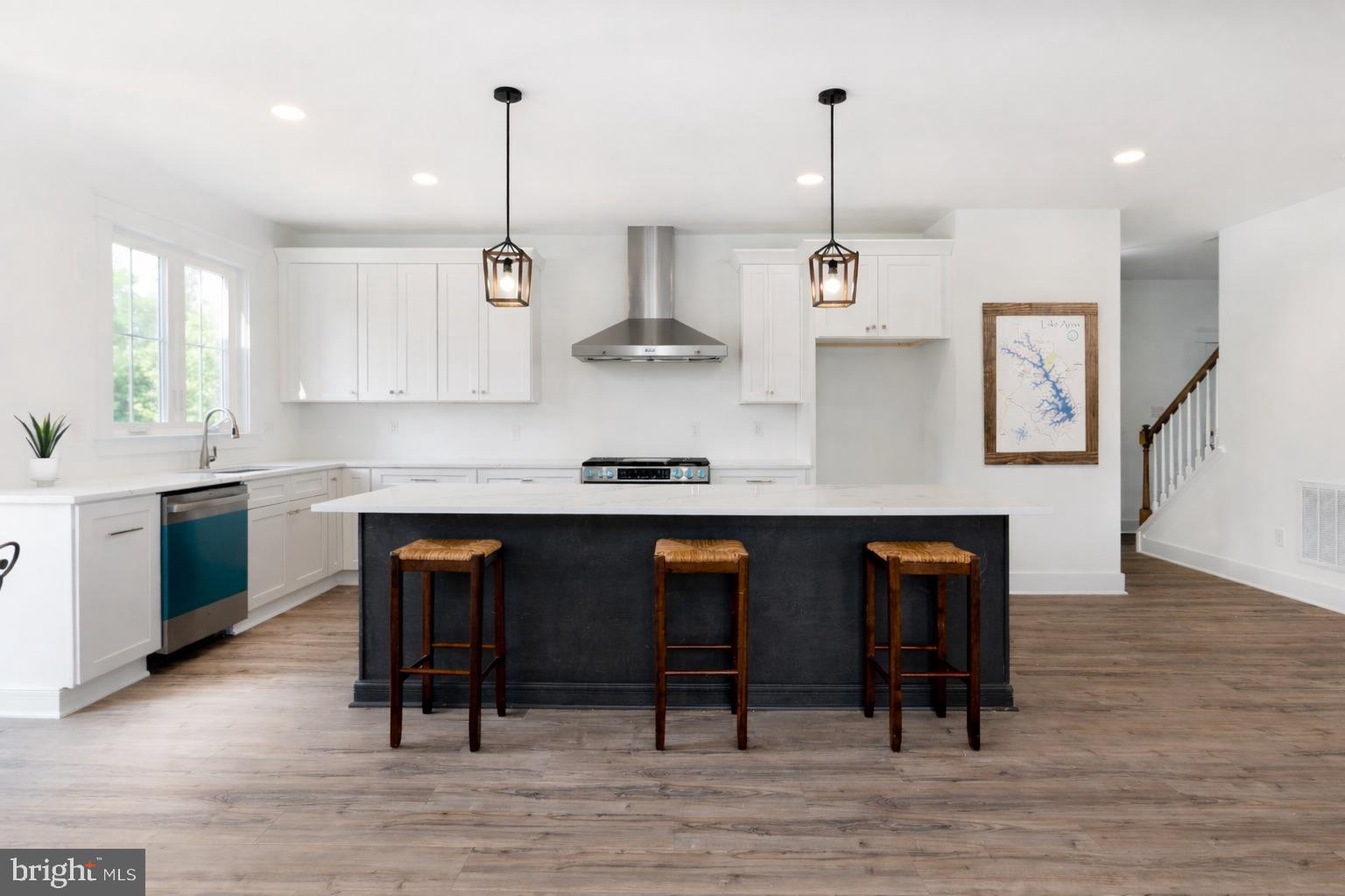 723 Rainbow Ridge Bumpass, VA 23024 - Photo 14 of 60 a kitchen with stainless steel appliances granite countertop a refrigerator a stove and a wooden floors