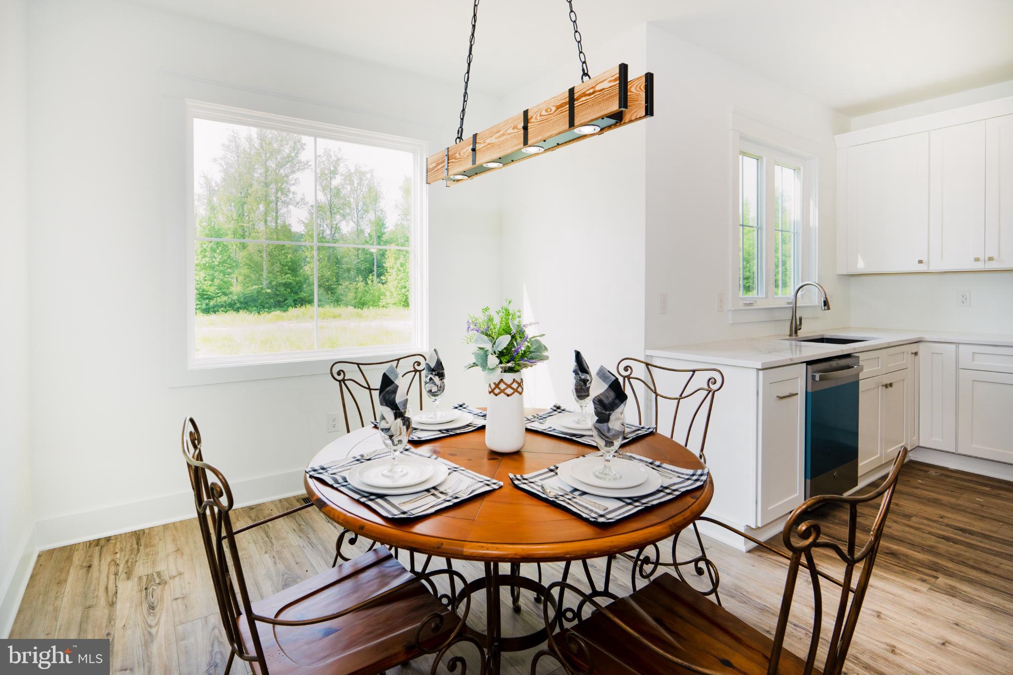 723 Rainbow Ridge Bumpass, VA 23024 - Photo 16 of 60 a view of a dining room with furniture and window