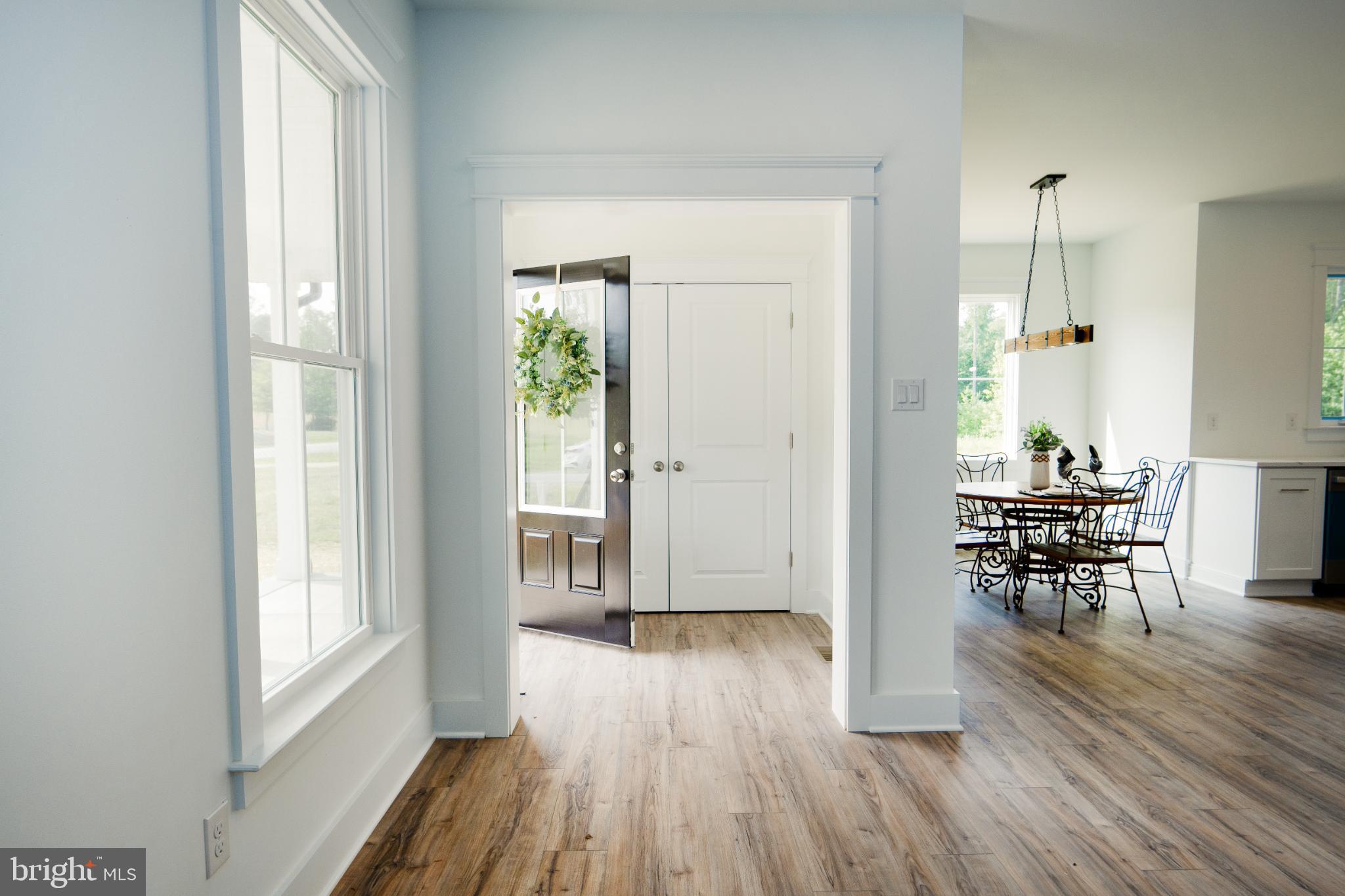 723 Rainbow Ridge Bumpass, VA 23024 - Photo 19 of 60 a view of a dining room with furniture window and wooden floor