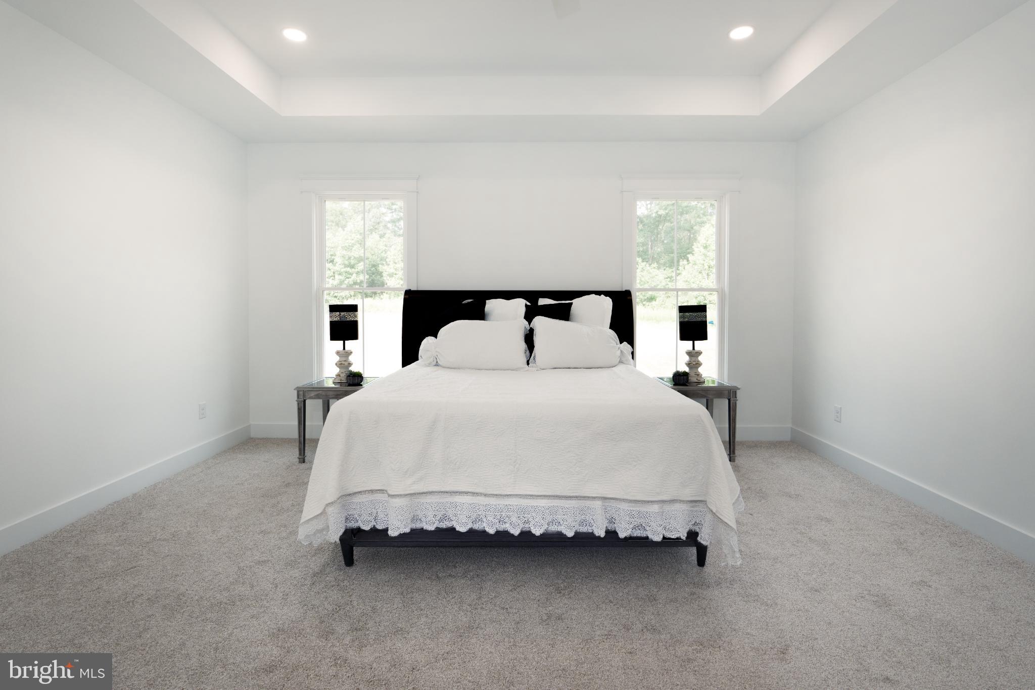 723 Rainbow Ridge Bumpass, VA 23024 - Photo 21 of 60 a spacious bedroom with a bed and a window