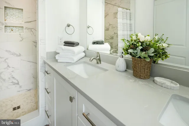 a bed room with a bed and a chandelier