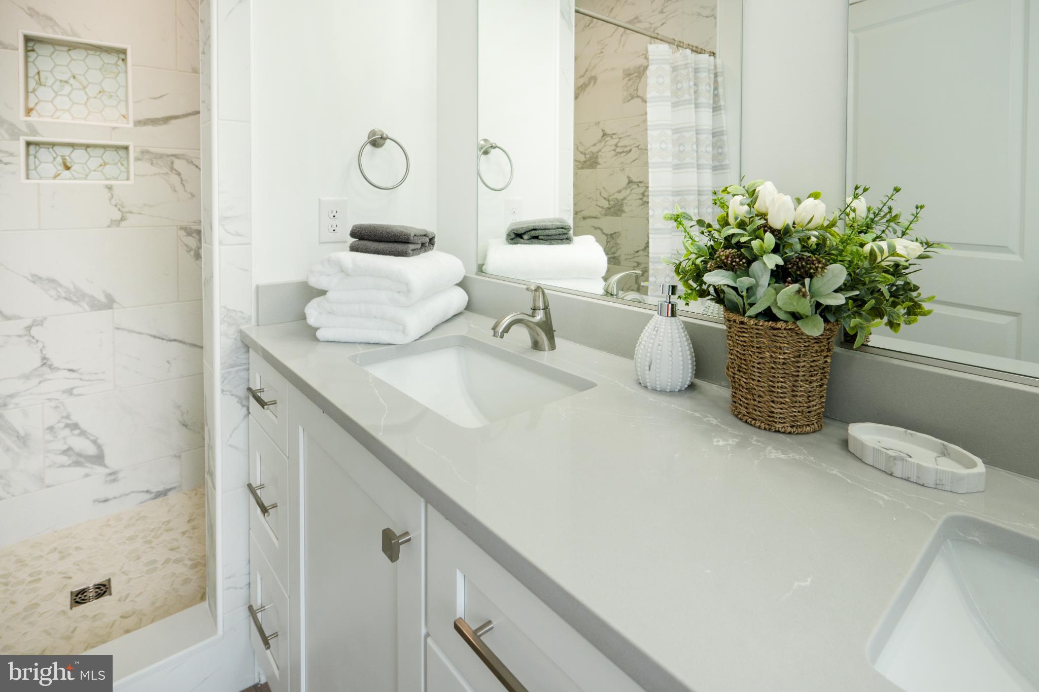 723 Rainbow Ridge Bumpass, VA 23024 - Photo 24 of 60 a bathroom with a granite countertop sink a toilet and shower