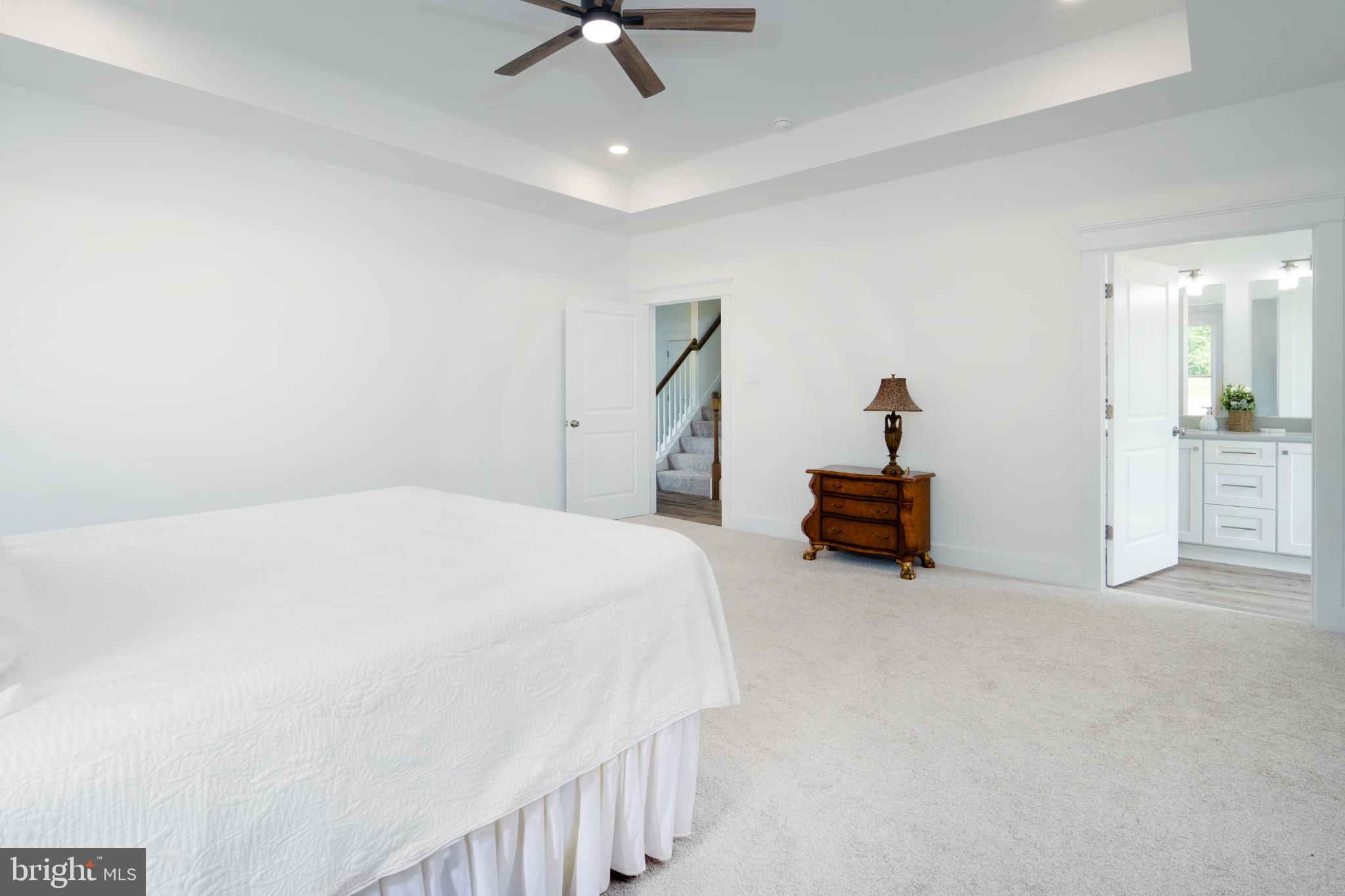 723 Rainbow Ridge Bumpass, VA 23024 - Photo 26 of 60 a bed room with a bed and a chandelier