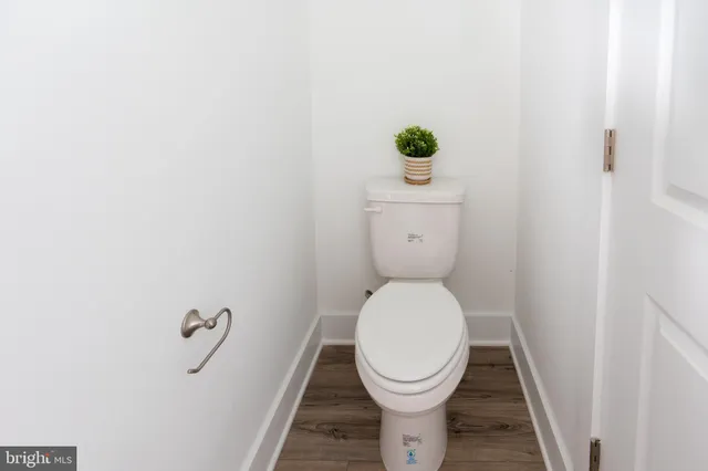 an entryway and livingroom with furniture